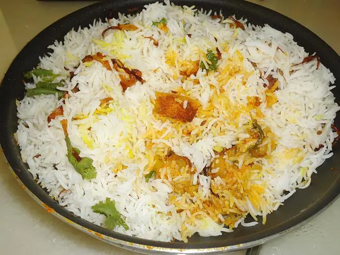 garnish potato biryani serve with raita