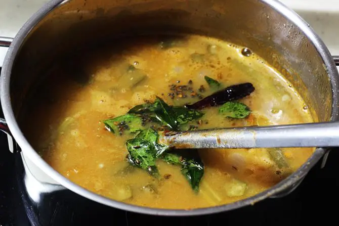 addition of spice seasoning to the boiling sambar