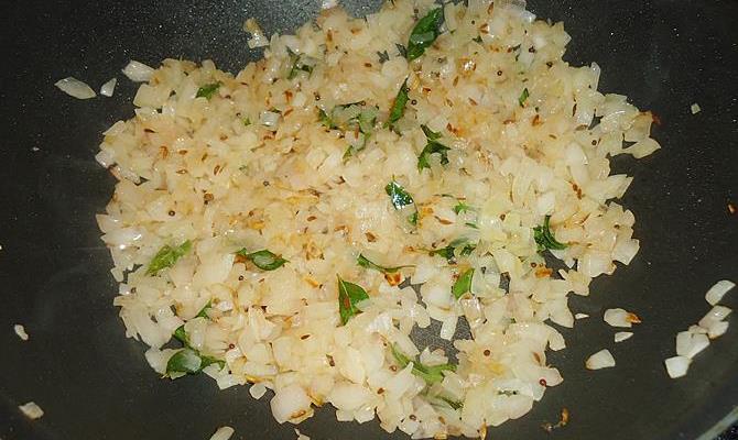 mustard cumin oil in a pan to make ridge gourd curry