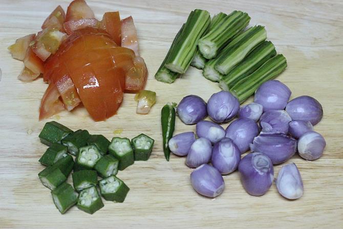 chopping mixed vegetables for making sambar recipe