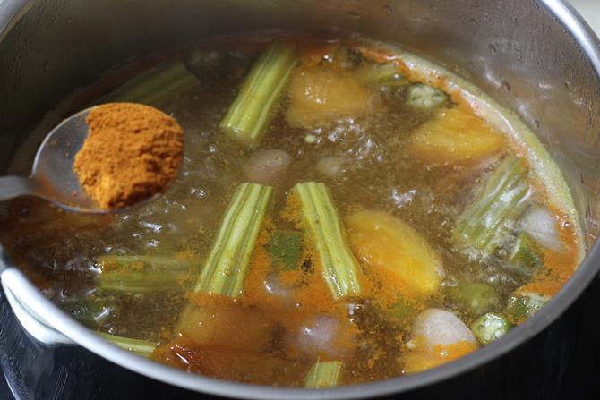 addition of ground powder to cooked veggies to make south indian sambar recipe