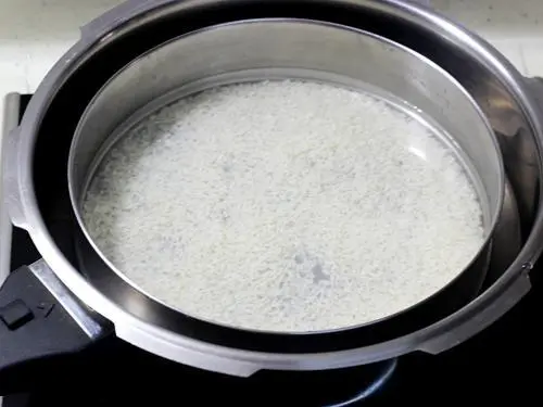cook rice in pressure cooker for bisi bele bath recipe