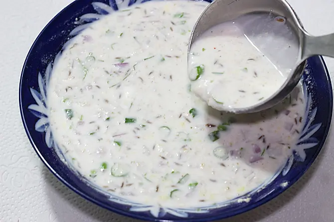 mixing ingredients for oats dosa