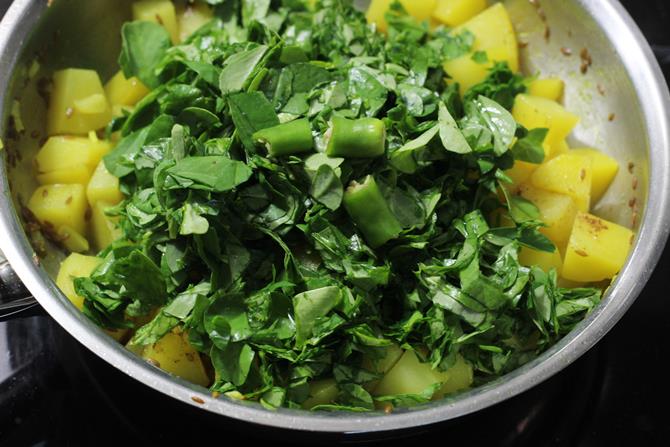 frying aloo methi and garnishing