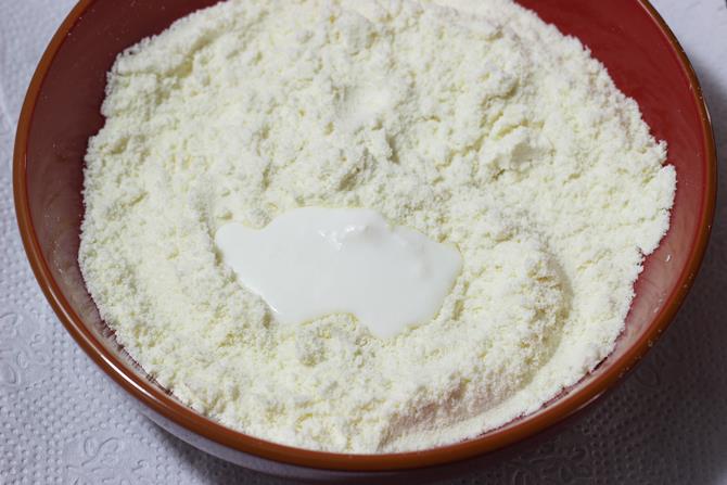 mixing flour to form dough to make gulab jamun recipe