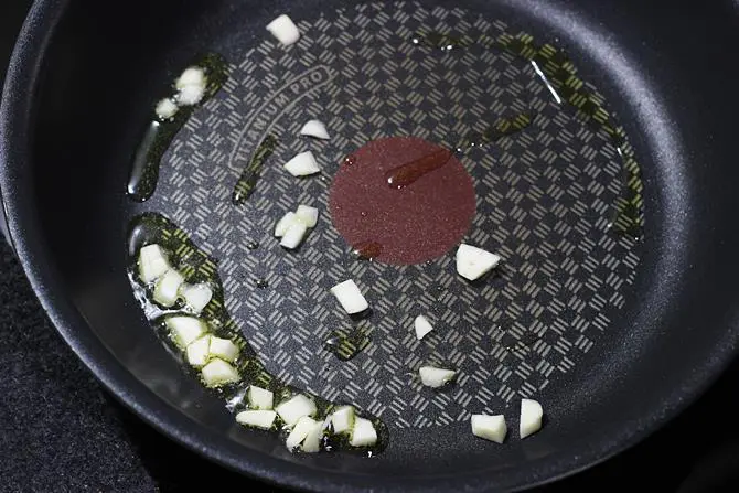 sauteing garlic for chilli mushroom stir fry