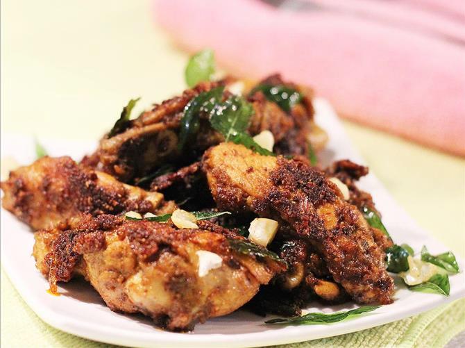garnishing chicken roast with curry leaves
