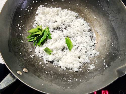 toasting coconut and curry leaves