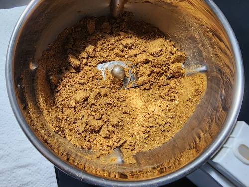 powdered whole spices in a jar