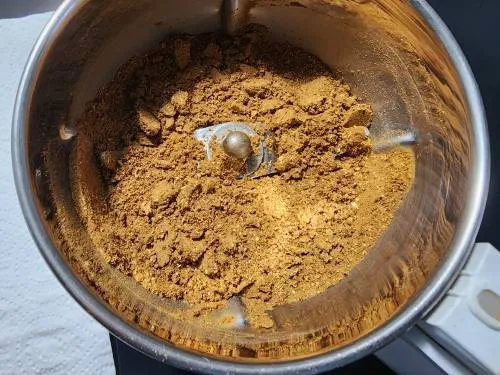 powdered whole spices in a jar
