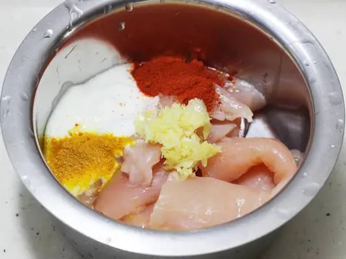 marinate chicken with marinade to make chicken pulao