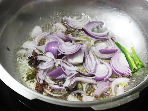 frying onions till golden to make chicken pulao recipe
