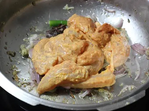 frying chicken to make pulao