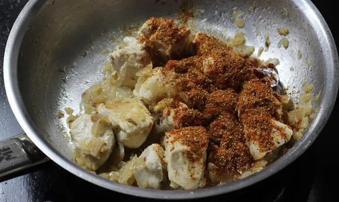 addition of garam masala to make kadai chicken recipe