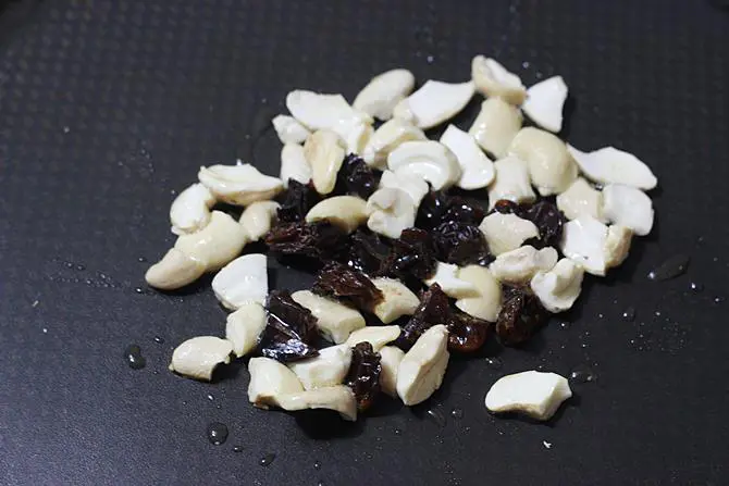 frying cashews to golden to make saggubiyyam payasam recipe