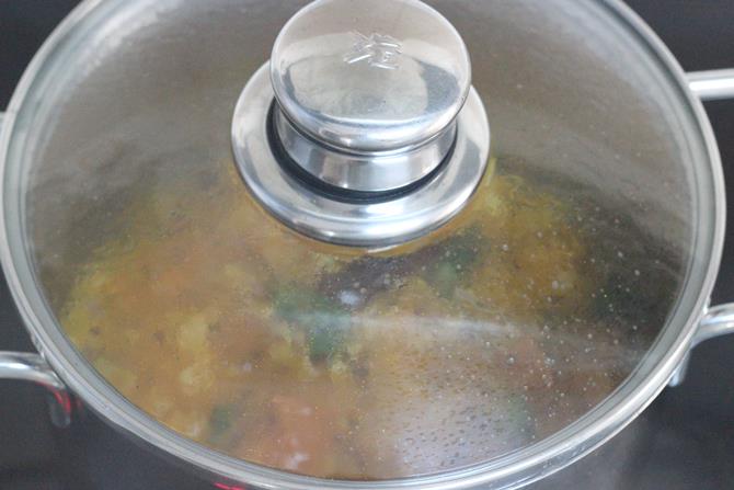 cooking covered on a low heat for making tomato rasam step 4