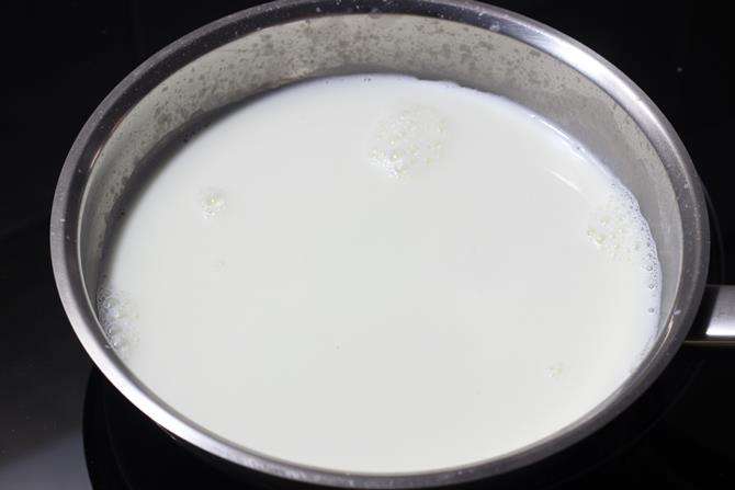 boiling milk in a pan