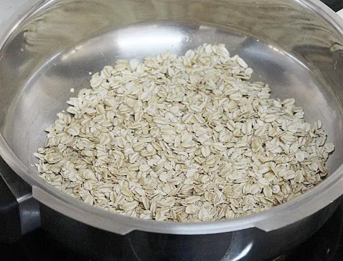 dry roasting oatmeal in pan for oats laddu