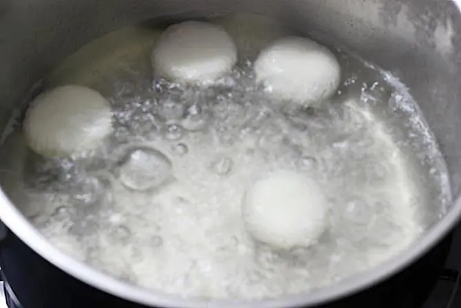 boiling discs in sugar syrup for rasmalai recipe
