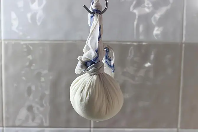 hanging paneer for draining in rasmalai recipe