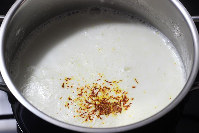 making rabri with milk for rasmalai recipe