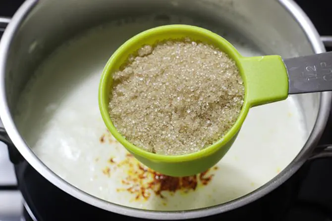 adding sugar for rabri in rasmalai recipe