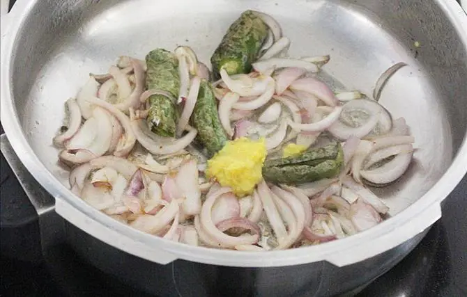frying onions chilies to make shorba recipe