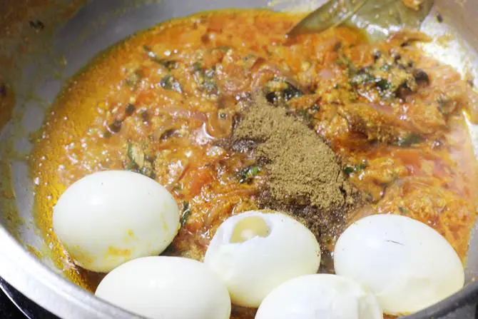 adding eggs to the pan to make egg biryani