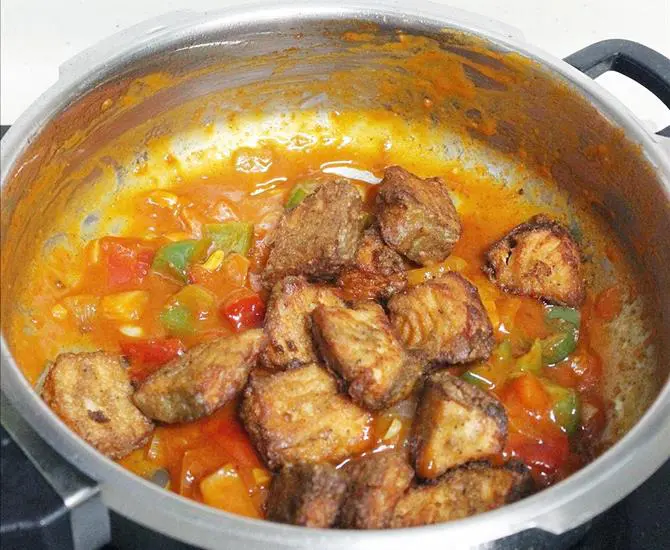 garnished chilli fish with spring onions