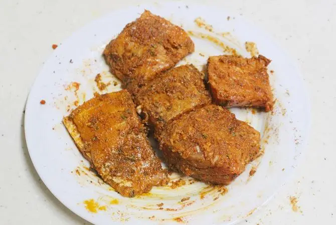 marinated fillet with spices to make amritsari fish fry