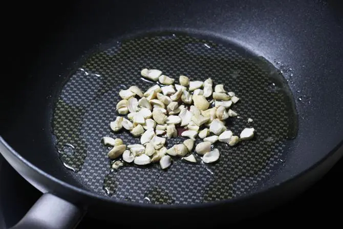 frying nuts in ghee to make pumpkin halwa