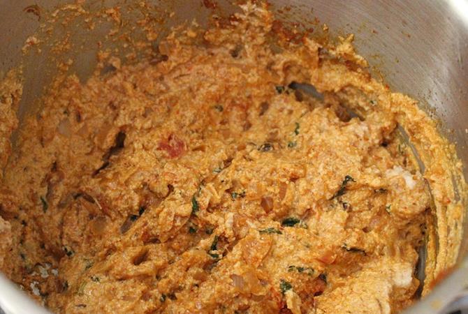 cooking paneer korma curry with coconut paste