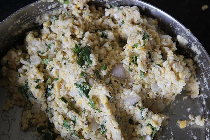 mixing dough with mint garlic paste for dal vada recipe