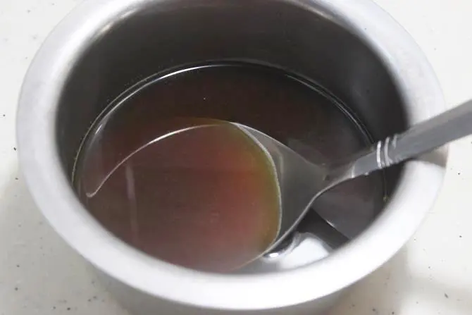 melting jaggery in water to make bellam undrallu recipe