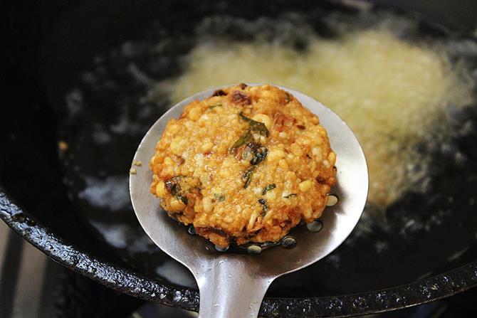 deep frying fritters in hot oil for dal vada recipe