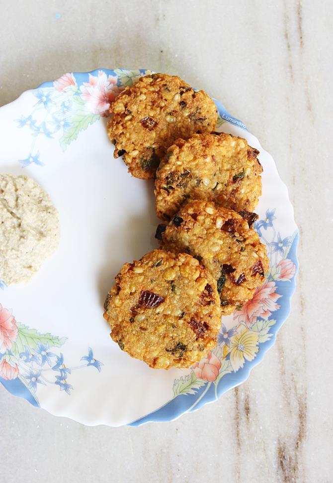 serving south indian style mixed dal vada with chutney