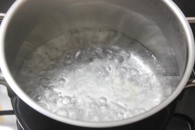 boiling water to make kudumulu
