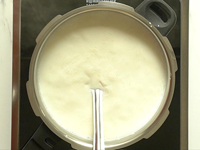 cooking rice in milk for rice payasam