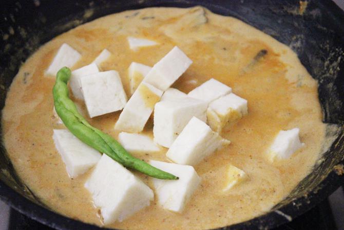 adding paneer in shahi paneer gravy