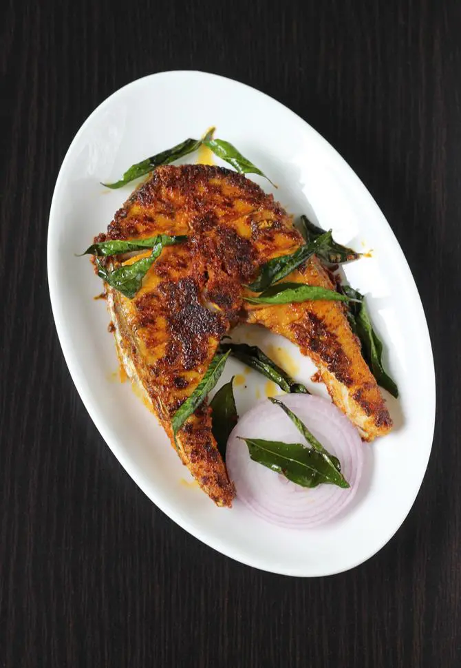 garnishing with crispy curry leaves