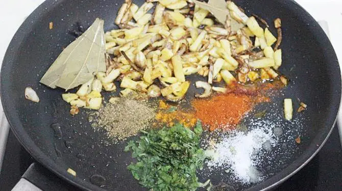 addition of spice powders for making indian potato rice recipe