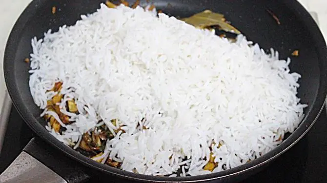 addition of rice to fry for potato rice recipe