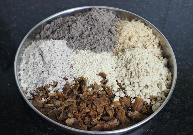 blend peanuts sesame seeds coconut to make ragi ladoo