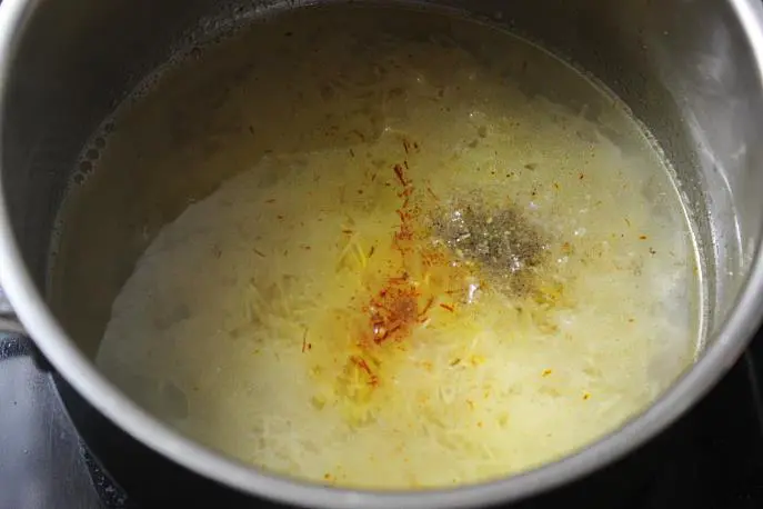 adding hot water to make semiya kesari recipe
