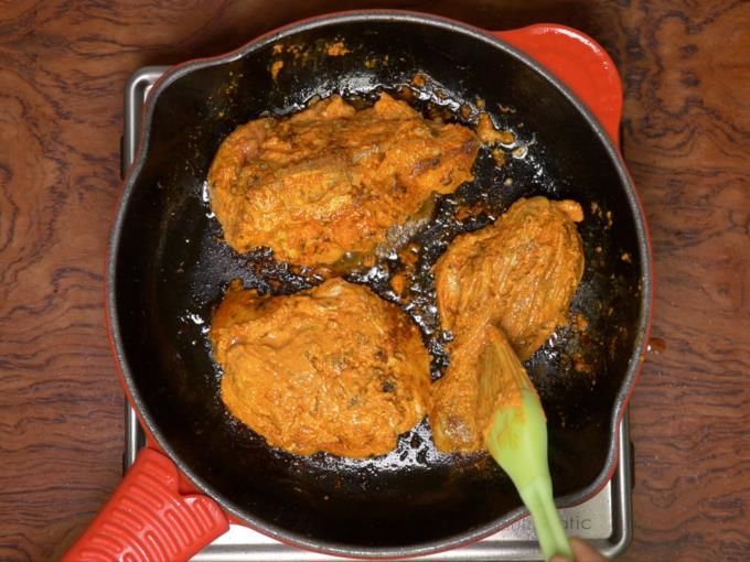 Basting marinade on tandoori chicken