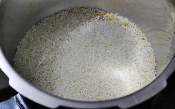 addition of rice for ven pongal recipe