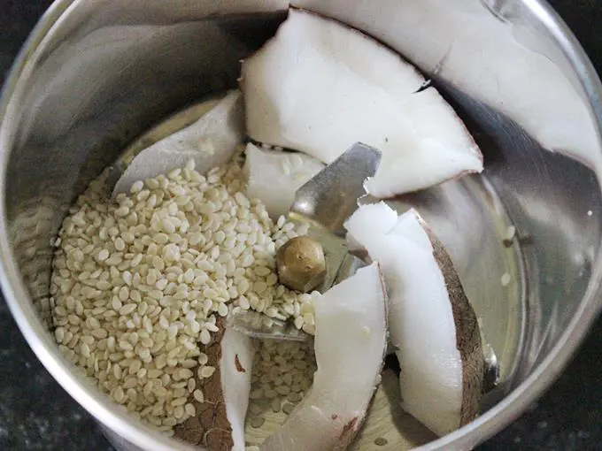 add fresh coconut and sesame seeds