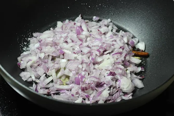 frying onions till golden in oil to make egg masala
