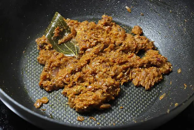 frying cashew onion tomato mixture to make egg masala