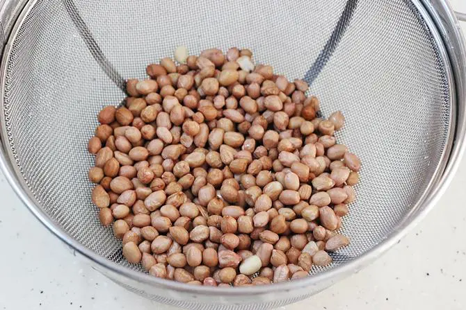 Clean and rinse peanuts under running water
